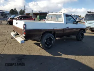 1987 Nissan Hardbody E z VIN JN6ND11S4HW011430, wystawiony jako Copart lot #81785214 z przebiegiem 334 566 mil mil oraz Tytuł czysty. Historia ofert i sprzedaży dostępna na DreamBid. Obrazek 3.
