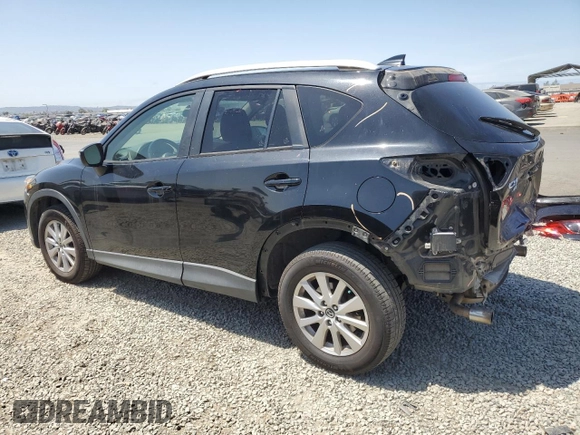 2016 Mazda CX-5 Touring with VIN JM3KE4CY2G0867484, listed as a Copart auction lot 54545435 with 100,664 mi miles and Salvage Title. Bid and sale history available at carsss.com. Image 2.