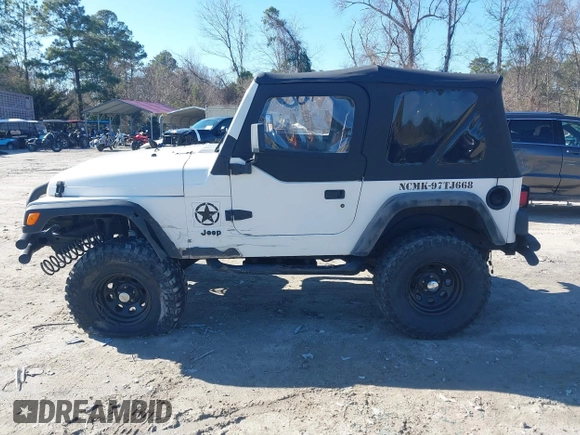 1997 Jeep Wrangler Sport with VIN 1J4FY19S7VP483735, listed as a IAAI auction lot 41469983 with 150,542 mi miles. Bid and sale history available at carsss.com. Image 14.