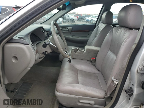 2001 Chevrolet Impala with VIN 2G1WF52E619288458, listed as a Copart auction lot 44365025 with 128,458 mi miles and Salvage title. Bid and sale history available at DreamBid. Image 7.