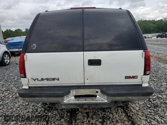1999 GMC Yukon with VIN 1GKEK13R8XJ723636, listed as a Copart auction lot 64458594 with 0 mi miles and Non Repairable. Bid and sale history available at carsss.com. Image 6.