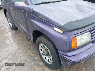 1993 Suzuki Sidekick z VIN 2S3TA01C4P6406238, wystawiony jako IAAI lot #41469419 z przebiegiem 126 667 mil mil oraz . Historia ofert i sprzedaży dostępna na DreamBid. Obrazek 6.