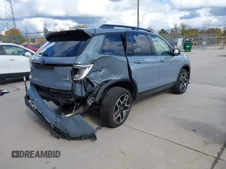 2023 Honda Passport Elite with VIN 5FNYF8H03PB000039, listed as a IAAI auction lot 40593339 with 33,697 mi miles and . Bid and sale history available at DreamBid. Image 4.