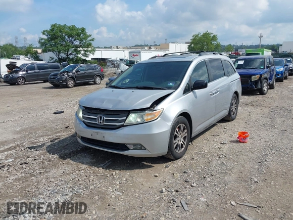 2012 Honda Odyssey EX-L with VIN 5FNRL5H61CB081634, listed as a IAAI auction lot 42760909 with 197,949 mi miles and . Bid and sale history available at DreamBid. Image 23.