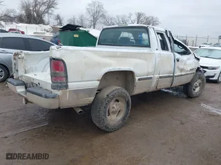 1999 Dodge Ram 1500 with VIN 1B7HF13Z3XJ651659, listed as a IAAI auction lot 41717323 with 230,729 mi miles. Bid and sale history available at carsss.com. Image 4.