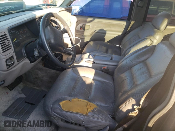 1999 GMC Yukon with VIN 1GKEC13R9XJ704929, listed as a Copart auction lot 89097295 with 87,478 mi miles and Salvage Title. Bid and sale history available at carsss.com. Image 7.