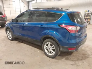 2017 Ford Escape SE z VIN 1FMCU0G90HUA94581, wystawiony jako IAAI lot #41396965 z przebiegiem 104 978 mil mil oraz . Historia ofert i sprzedaży dostępna na DreamBid. Obrazek 3.