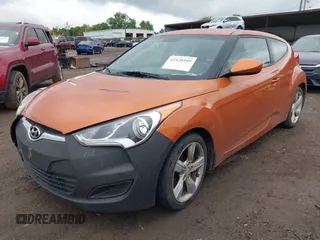 2012 Hyundai Veloster w/Gray Int with VIN KMHTC6AD3CU057620, listed as a IAAI auction lot 42320549 with 113,491 mi miles and . Bid and sale history available at DreamBid. Image 2.