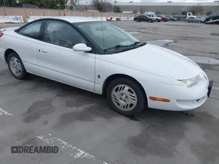 1999 Saturn SC with VIN 1G8ZY1271XZ276834, listed as a IAAI auction lot 41445985 with 62,428 mi miles. Bid and sale history available at carsss.com. Image 1.