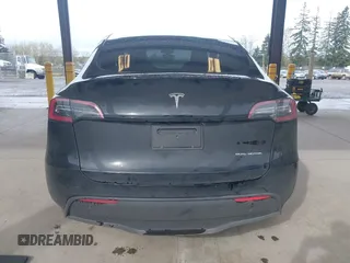 2023 Tesla Model Y Long Range with VIN 7SAYGDEE0PF909610, listed as a IAAI auction lot 41906081 with 20,656 mi miles and . Bid and sale history available at DreamBid. Image 17.