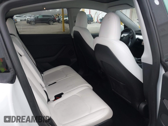 2023 Tesla Model Y Long Range with VIN 7SAYGAEE7PF766735, listed as a IAAI auction lot 41626651 with 21,983 mi miles. Bid and sale history available at carsss.com. Image 8.