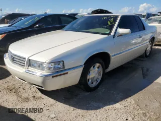 2000 Cadillac Eldorado z VIN 1G6EL12Y0YB704658, wystawiony jako Copart lot #77596814 z przebiegiem Nie podano mil oraz Nie do naprawy • Non repairable. Historia ofert i sprzedaży dostępna na DreamBid. Obrazek 1.