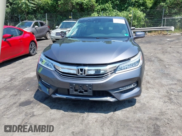 2016 Honda Accord Touring with VIN 1HGCR3F94GA009459, listed as a IAAI auction lot 42597128 with 182,977 mi miles and . Bid and sale history available at DreamBid. Image 12.