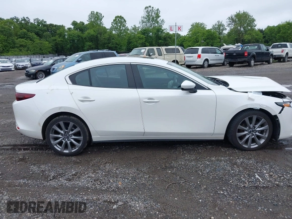 2021 Mazda 3 Preferred z VIN 3MZBPBCL0MM250862, wystawiony jako IAAI lot #42318612 z przebiegiem 86 056 mil mil oraz . Historia ofert i sprzedaży dostępna na DreamBid. Obrazek 13.