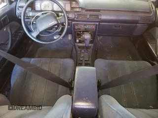 1991 Toyota Camry z VIN 4T1VV21E8MU050409, wystawiony jako Copart lot #61379824 z przebiegiem 100 949 mil mil oraz Nie do naprawy • Non repairable. Historia ofert i sprzedaży dostępna na DreamBid. Obrazek 8.