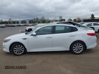2016 Kia Optima EX with VIN 5XXGU4L31GG086203, listed as a IAAI auction lot 42128099 with 157,988 mi miles. Bid and sale history available at carsss.com. Image 14.