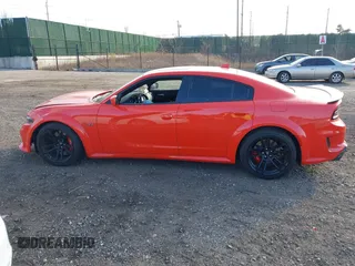 2022 Dodge Charger Scat Pack Widebody with VIN 2C3CDXGJ3NH101081, listed as a IAAI auction lot 41351466 with 9,575 mi miles and . Bid and sale history available at DreamBid. Image 14.