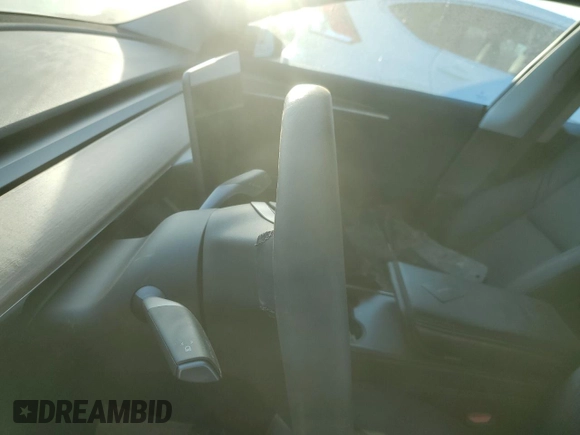 2023 Tesla Model 3 Long Range with VIN 5YJ3E1EB3PF703943, listed as a Copart auction lot 46411505 with Not Provided miles and Salvage Title. Bid and sale history available at DreamBid. Image 9.