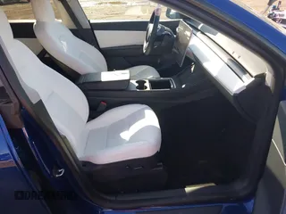 2021 Tesla Model Y Long Range with VIN 5YJYGDEE8MF293230, listed as a IAAI auction lot 41744033 with 56,797 mi miles and . Bid and sale history available at DreamBid. Image 5.
