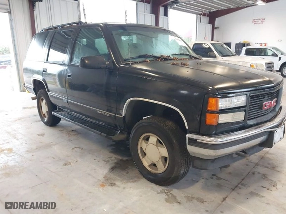 1996 GMC Yukon with VIN 1GKEK13R2TJ743987, listed as a IAAI auction lot 41652826 with 325,292 mi miles. Bid and sale history available at carsss.com. Image 1.
