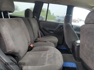 2000 Jeep Grand Cherokee Laredo z VIN 1J4GW48S1YC326453, wystawiony jako Copart lot #57332675 z przebiegiem 290 059 mil mil oraz Czysty tytuł • Clean title. Historia ofert i sprzedaży dostępna na DreamBid. Obrazek 11.