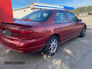 1999 Ford Contour SE Fleet z VIN 1FAFP66L2XK149217, wystawiony jako Copart lot #79546104 z przebiegiem 231 245 mil mil oraz Tytuł czysty. Historia ofert i sprzedaży dostępna na DreamBid. Obrazek 4.