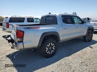 2018 Toyota Tacoma SR with VIN 3TMCZ5AN6JM129370, listed as a Copart auction lot 63042425 with 65,189 mi miles and Salvage title. Bid and sale history available at DreamBid. Image 3.