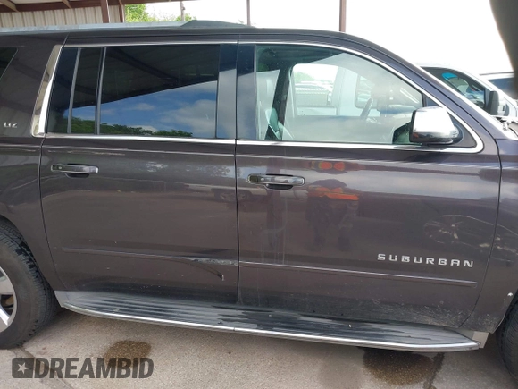 2015 Chevrolet Suburban LTZ with VIN 1GNSCKKC7FR272138, listed as a IAAI auction lot 42047823 with 198,314 mi miles and . Bid and sale history available at DreamBid. Image 13.