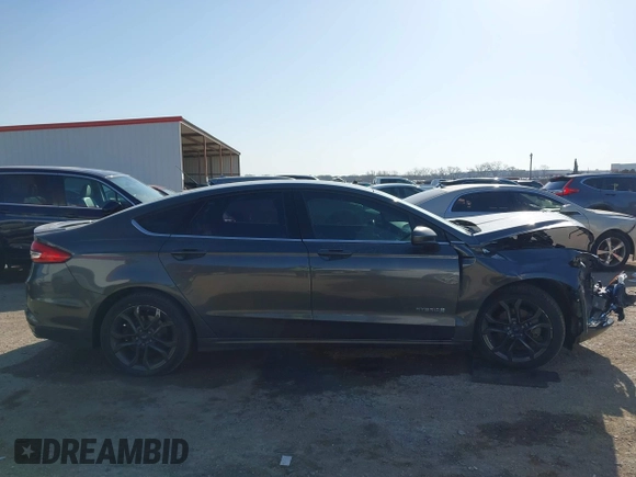 2018 Ford Fusion SE z VIN 3FA6P0LU8JR116073, wystawiony jako IAAI lot #41773037 z przebiegiem 100 864 mil mil oraz . Historia ofert i sprzedaży dostępna na DreamBid. Obrazek 13.