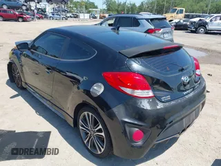 2016 Hyundai Veloster Turbo with VIN KMHTC6AE5GU281597, listed as a IAAI auction lot 42006038 with 77,642 mi miles. Bid and sale history available at carsss.com. Image 3.