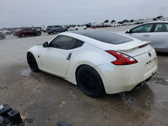 2010 Nissan 370Z with VIN JN1AZ4EH9AM506522, listed as a Copart auction lot 85807034 with 131,357 mi miles and Salvage Title. Bid and sale history available at carsss.com. Image 2.