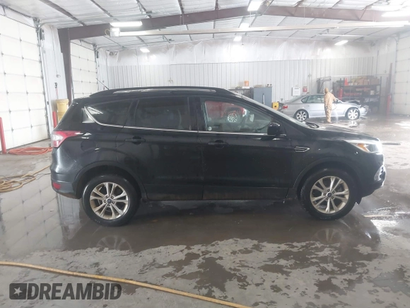 2018 Ford Escape SE with VIN 1FMCU0G99JUC89312, listed as a IAAI auction lot 41484138 with 149,739 mi miles. Bid and sale history available at carsss.com. Image 13.
