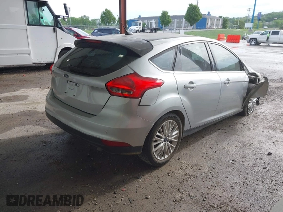 2015 Ford Focus Titanium z VIN 1FADP3N2XFL348149, wystawiony jako IAAI lot #41983021 z przebiegiem 208 765 mil mil oraz . Historia ofert i sprzedaży dostępna na DreamBid. Obrazek 4.