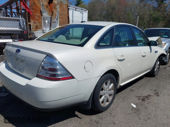 2009 Ford Taurus SE with VIN 1FAHP23W89G113022, listed as a IAAI auction lot 42118187 with 135,319 mi miles. Bid and sale history available at carsss.com. Image 4.
