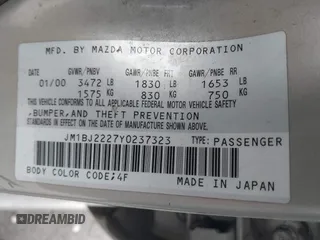 2000 Mazda Protege DX with VIN JM1BJ2227Y0237323, listed as a IAAI auction lot 42179683 with Not Provided miles and . Bid and sale history available at DreamBid. Image 9.