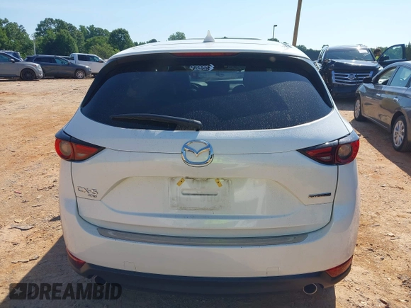 2021 Mazda CX-5 Grand Touring with VIN JM3KFBDM3M0493752, listed as a IAAI auction lot 42456854 with 35,122 mi miles and . Bid and sale history available at DreamBid. Image 16.