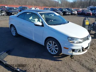 2015 Volkswagen Eos Komfort with VIN WVWBW8AH0FV001011, listed as a IAAI auction lot 41297299 with 81,444 mi miles and . Bid and sale history available at DreamBid. Image 1.