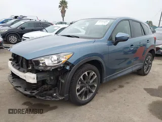 2016 Mazda CX-5 Grand Touring with VIN JM3KE2DY7G0875678, listed as a IAAI auction lot 42104888 with 30,566 mi miles. Bid and sale history available at carsss.com. Image 2.