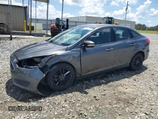 2016 Ford Focus SE with VIN 1FADP3F29GL233719, listed as a Copart auction lot 56857705 with 140,785 mi miles and Salvage title. Bid and sale history available at DreamBid. Image 1.