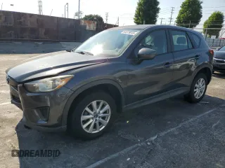 2014 Mazda CX-5 Sport with VIN JM3KE2BE7E0309090, listed as a Copart auction lot 64979815 with 72,475 mi miles and Salvage title. Bid and sale history available at DreamBid. Image 1.