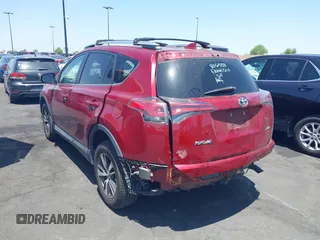 2018 Toyota RAV4 XLE with VIN 2T3WFREV4JW505053, listed as a IAAI auction lot 42552459 with 94,552 mi miles and . Bid and sale history available at DreamBid. Image 3.