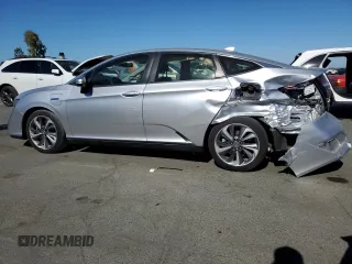 2020 Honda Clarity Plug-In Hybrid with VIN JHMZC5F13LC002533, listed as a Copart auction lot 76206644 with 144,022 mi miles and Salvage Title. Bid and sale history available at carsss.com. Image 2.
