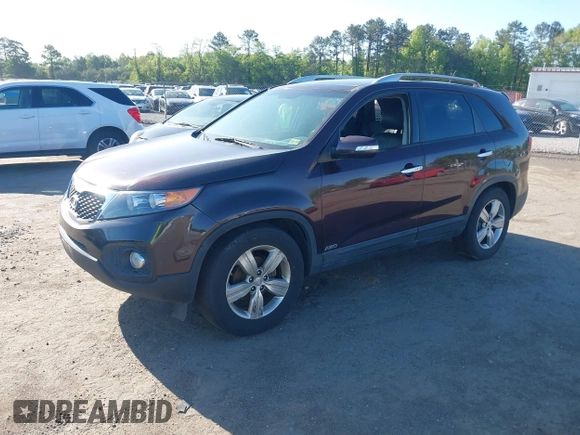 2012 Kia Sorento EX with VIN 5XYKUDA23CG206609, listed as a IAAI auction lot 42142072 with 162,574 mi miles. Bid and sale history available at carsss.com. Image 2.