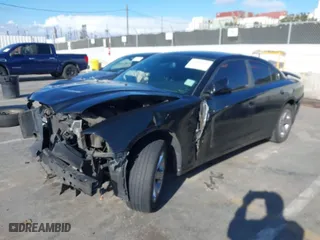 2014 Dodge Charger SXT with VIN 2C3CDXHG9EH184096, listed as a IAAI auction lot 41802634 with 175,386 mi miles. Bid and sale history available at carsss.com. Image 2.