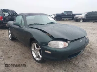 1999 Mazda MX-5 Miata z VIN JM1NB3539X0123231, wystawiony jako IAAI lot #42314156 z przebiegiem 154 755 mil mil oraz . Historia ofert i sprzedaży dostępna na DreamBid. Obrazek 1.