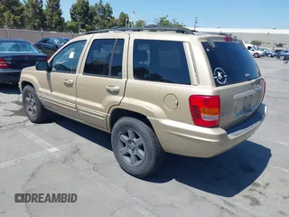 2000 Jeep Grand Cherokee Laredo z VIN 1J4G258S5YC237373, wystawiony jako IAAI lot #42736569 z przebiegiem 103 310 mil mil oraz . Historia ofert i sprzedaży dostępna na DreamBid. Obrazek 3.
