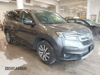 2021 Honda Pilot EX-L with VIN 5FNYF5H58MB005811, listed as a IAAI auction lot 41575276 with 167,544 mi miles. Bid and sale history available at carsss.com. Image 1.