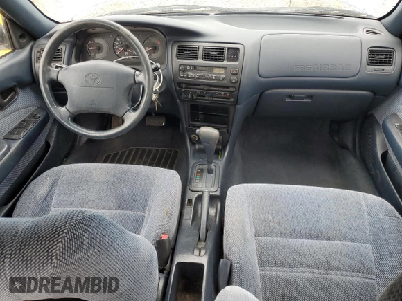 1995 Toyota Corolla DX with VIN 2T1AE09B5SC127586, listed as a Copart auction lot 57075045 with 244,969 mi miles and Salvage title. Bid and sale history available at DreamBid. Image 8.