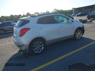 2016 Buick Encore Premium with VIN KL4CJDSB1GB647306, listed as a IAAI auction lot 41983159 with 59,592 mi miles. Bid and sale history available at carsss.com. Image 4.