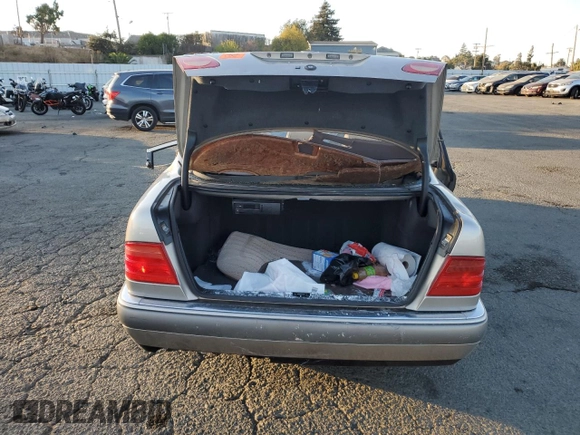 1997 Mercedes-Benz E-Class with VIN WDBJF55F8VA415967, listed as a Copart auction lot 74144924 with 0 mi miles and Salvage Title. Bid and sale history available at carsss.com. Image 6.